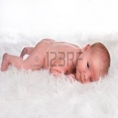 15 Days Old Baby Lying On A Fluffy White Carpet Royalty Free Stock - Karbonix