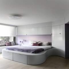 Bed Shape Fills With Purple Quilt In White Purple Theme Bedroom Curve - Karbonix