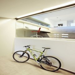 Bicycle Next To White Wall In Green - Karbonix