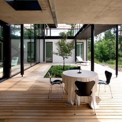 Brown Chairs Rounded Table With White Table Cloth In Space Dark - Karbonix