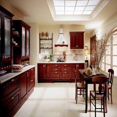 Brown Historical Dining Table Surrounded By Classic Wooden Kitchen Cabinet Dark - Karbonix