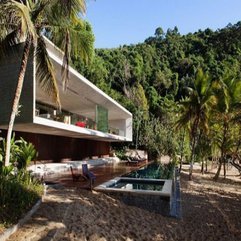 Concrete Beach House Designs With Outdoor Swimming Pool In Modern Style - Karbonix