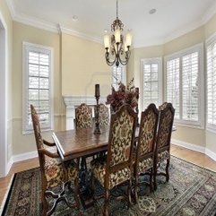 Dining Room Idea With Fireplace And Cream Colored Walls - Karbonix