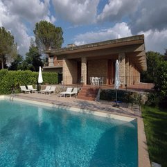 Exposed Stone Column Wall With Pool Lounge Chair Fascinating Design - Karbonix