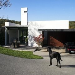 Front Home Yard Completed With Grey Driveway Small Patio - Karbonix