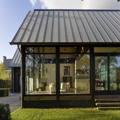 Glass Exhibition Room Framed With Galant Dark Brown Wooden Pillars Look Fashionable - Karbonix