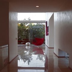 Glossy Silver Ornament Viewed From Hallway Red Chair - Karbonix