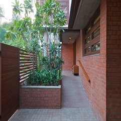 Green Plants Brick Wall Near Wooden Fences Small Garden - Karbonix