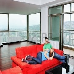 Best Inspirations : Happy Couple Relaxing On Red Sofa In Big Bright New Apartment - Karbonix
