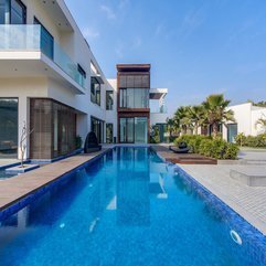 Home Combined With Wooden Accents Glass Window Viewed From Swimming Pool Two Levels - Karbonix