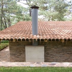 Home Interior Silver Chimney Placed On Stone Wall And Brown Roof - Karbonix