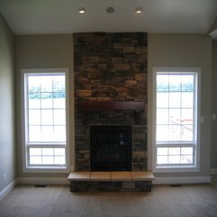 Interior Comfortable Living Area With Enchanting Stone Fireplace - Karbonix