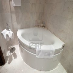 Interior Of Bathroom Design With Corner Bathtub Omsync - Karbonix