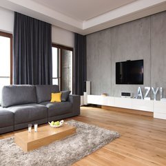 Interior Screen Flat TV Hanging On Grey Wall In Living Room - Karbonix