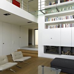 Interior White Chairs And Black Pouffe With Glazed Table Next To - Karbonix