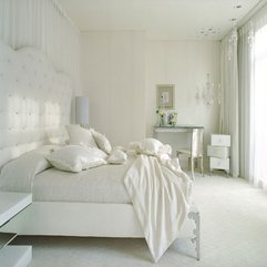Interior White Furry Pillows On White Bed In Bright White Bedroom - Karbonix