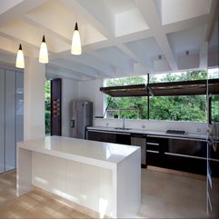 Interior White Kitchen Table With Black Shelf Under Opened Window - Karbonix