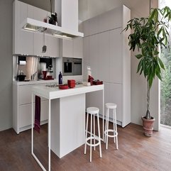 Kitchen With White Kitchen Countertop And Wooden Floor Minimalist White - Karbonix