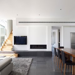 Minimalist Fireplace Next To Screen Flat TV In Open Plan - Karbonix