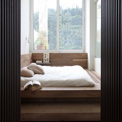 On Wooden Floor Near Glass Window White Bed - Karbonix