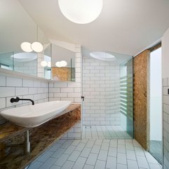 On Wooden Table Near Glazed Shower Area Bathroom White Washbasin - Karbonix