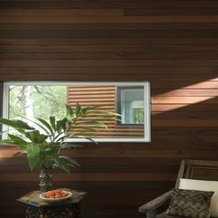 Plants On Table With Wooden Chair Under Small Glazed Window In Wooden Wall In Green - Karbonix