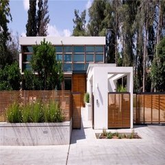 Plants Planted Near Wooden Fence For White Home In Green - Karbonix