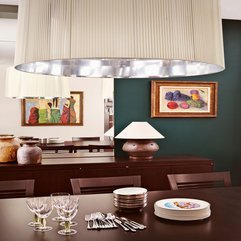 Plates On Wooden Dining Table Under Rounded Lamp On Ceiling Glass Ware - Karbonix