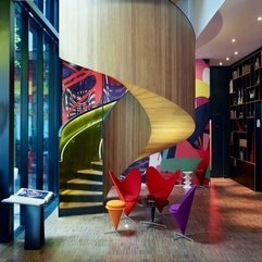 Red Unique Chairs With Black Rounded Table Placed Under Curved Stair Purple Orange - Karbonix