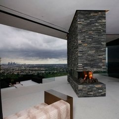 Stacked Stone Top Fireplace - Karbonix