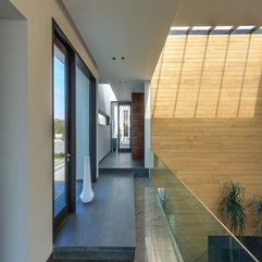 Upper Level Completed With White Accents Near Glass Door Hallway In - Karbonix