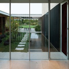 Viewed Through Transparent Glazed Wall Courtyard - Karbonix