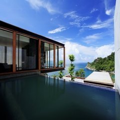 Wall With Wooden Frame Near Infinity Pool In Upper Level Glass Ware - Karbonix