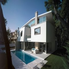White Home With Blue Swimming Pool Two Level - Karbonix