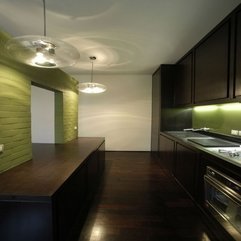 Wooden Interior And Green Accent Kitchen Space - Karbonix