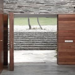 Yard Viewed From Open Wooden Door Stone Stairs - Karbonix