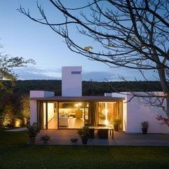 Yellow Lighting Inside Through Glazed Wall Minimalist Home - Karbonix